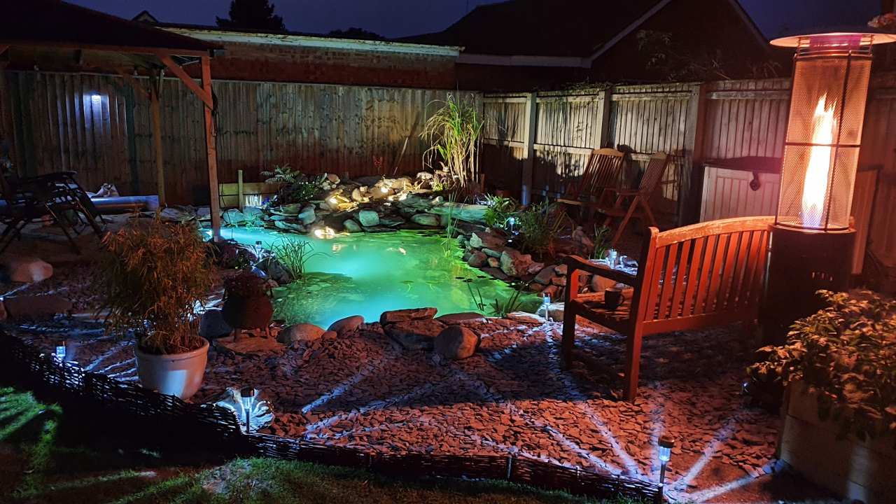 AN EcoSystem Koi pond lit up at night